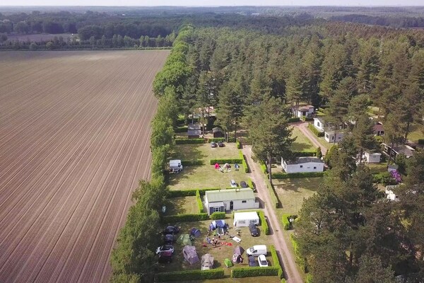 Foto van Cordelia Lodge met tuin en picknickplaats - Vakantiehuis in Ravels - AreaSummer5KM