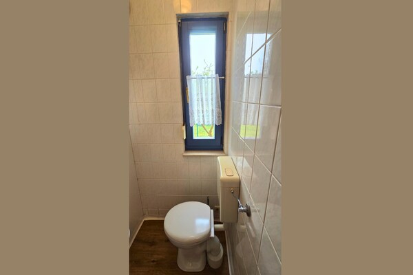 Foto van Bungalow in Schlowe aan het zie - Vakantiehuis in Borkow OT Schlowe - BathRoom