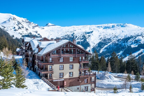 Foto van Berguitzicht vakantiehuis met balkon voor 8 - Vakantiehuis in Flaine - ExteriorWinter