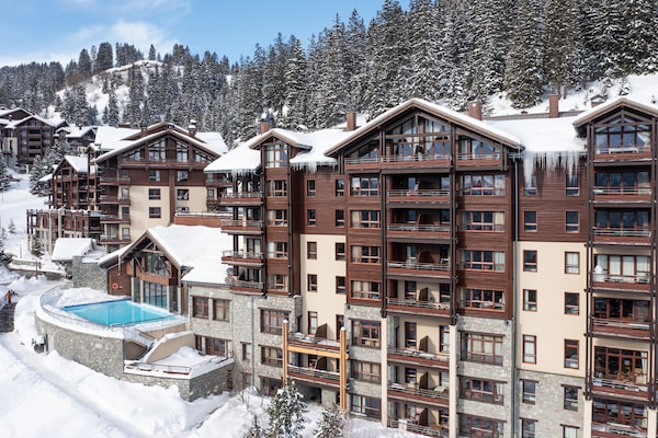 Foto van Berguitzicht vakantiehuis met balkon voor 8 - Vakantiehuis in Flaine - ExteriorWinter