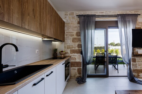 Foto van Gezellige villa met uitzicht op de tuin - Vakantiehuis in Pigi - Kitchen