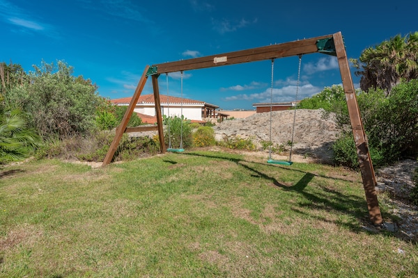 Foto van Residence met gemeenschappelijk zwembad in Palau - Vakantiehuis in Palau (SS) - ExteriorSummer