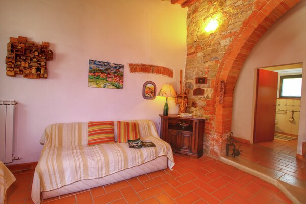 Foto van Glooiende boerderij van Val d'Orcia - Vakantiehuis in Castiglione D'orcia - LivingRoom