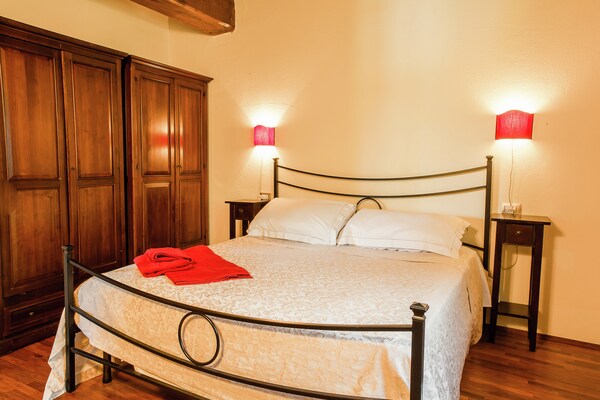 Foto van Romantisch appartement in Umbrië met centrale ligging - BedRoom