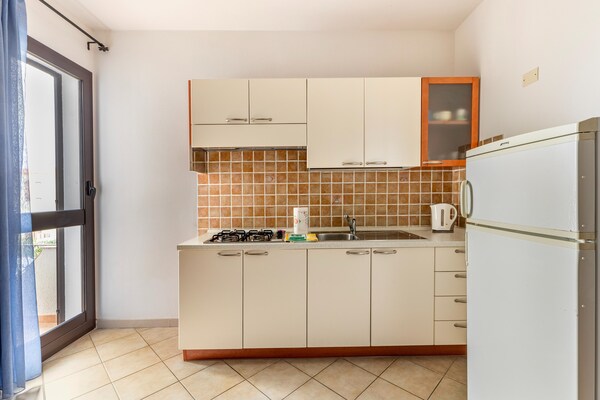 Foto van Appartement vlakbij zee, 2 zwembaden - Vakantiehuis in Valledoria - Kitchen