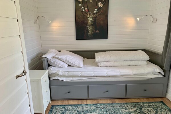 Foto van Bungalow vlakbij het strand met tuin - Vakantiehuis in Sint Maartensvlotbrug - BedRoom