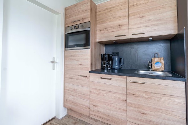 Foto van Comfortabel en modern ingericht 4-persoons appartement - Kitchen