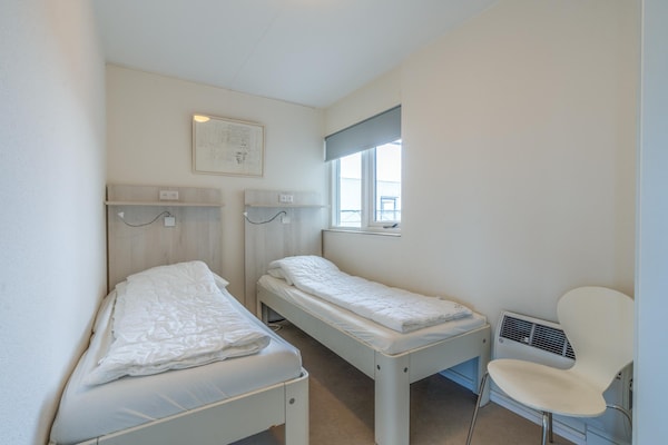 Foto van 4 Persoons appartement met zeezicht - Vakantiehuis in De Koog - BedRoom