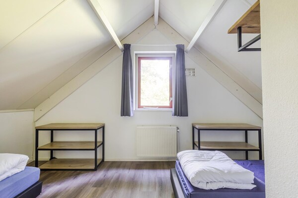 Foto van Saunabungalow aan het meer voor 4 - Vakantiehuis in Ewijk - BedRoom