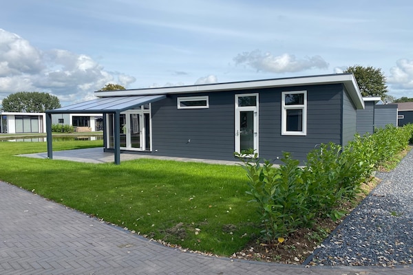 Foto van Chalet in Gelderland met ruime tuin - Vakantiehuis in Lathum - ExteriorSummer