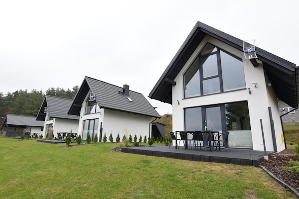 Foto van Huisje aan Kiedrowickie Meer met Roeiboot - Vakantiehuis in Kiedrowice - ExteriorWinter
