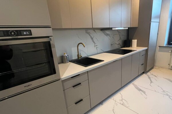 Foto van Appartement vlakbij Piotrkowska Street - Vakantiehuis in Łódź - Kitchen