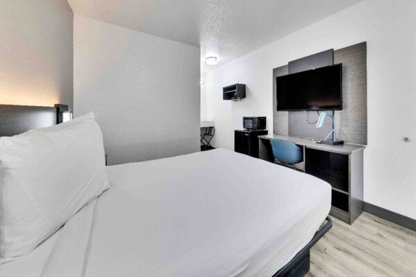 Foto van 1 tweepersoonsbed (queensize) | Minikoelkast - Vakantiehuis in Austin - BedRoom