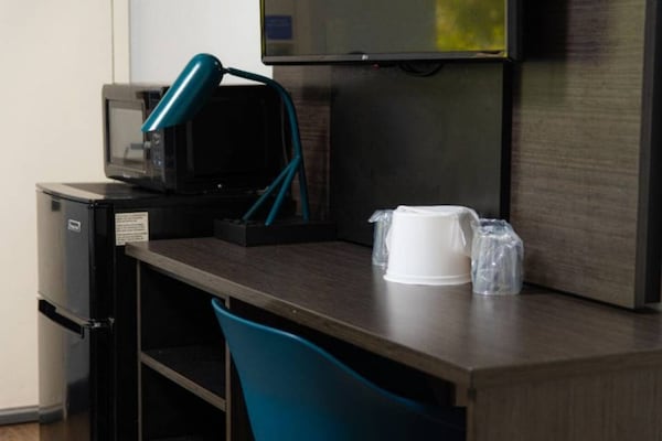 Foto van 2 tweepersoonsbedden | Premium, Micfridge - Vakantiehuis in Lantana - Facilities