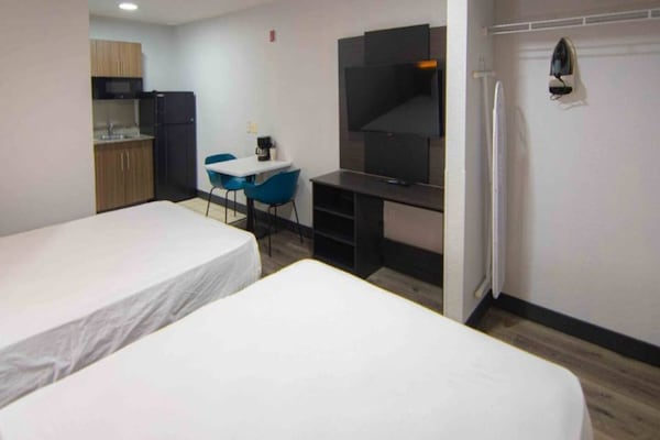 Foto van 2 queensize bedden Nmsk | Palm Beach - Vakantiehuis in West Palm Beach - BedRoom