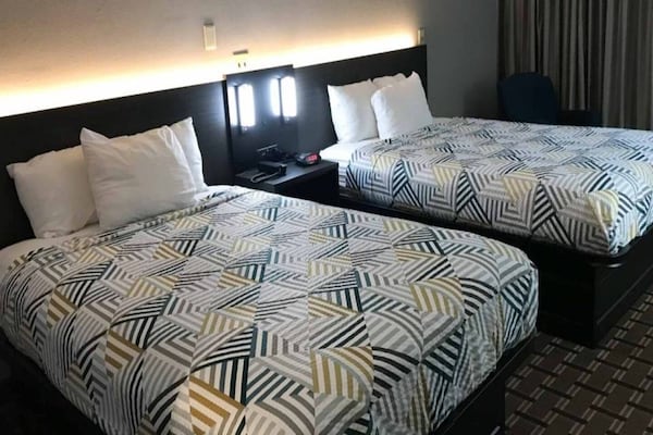 Foto van 2 tweepersoonsbedden | Roken toegestaan, koelkast - Vakantiehuis in Tupelo - BedRoom