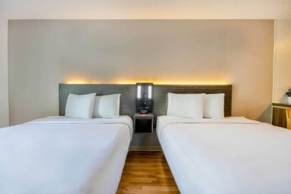 Foto van 2 tweepersoonsbedden, rokersgedeelte | San Antonio - BedRoom