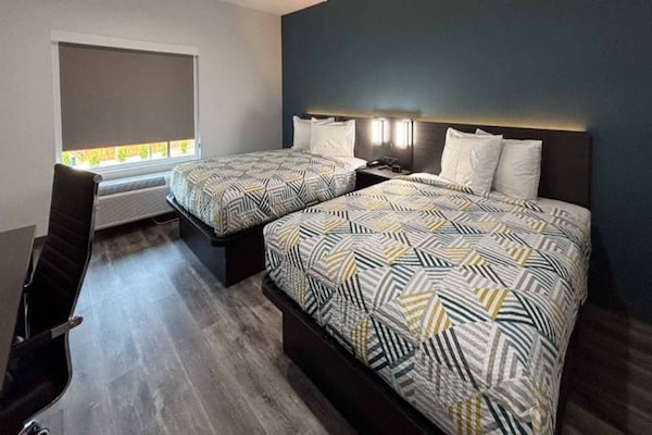 Foto van 2 tweepersoonsbedden | Rookvrij, Keuken - Vakantiehuis in Dallas - BedRoom