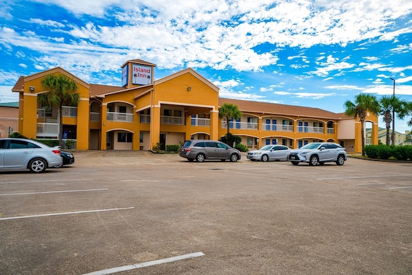 Foto van 2 tweepersoonsbedden (queensize) | Rookvrij - Vakantiehuis in Galveston TX - parking